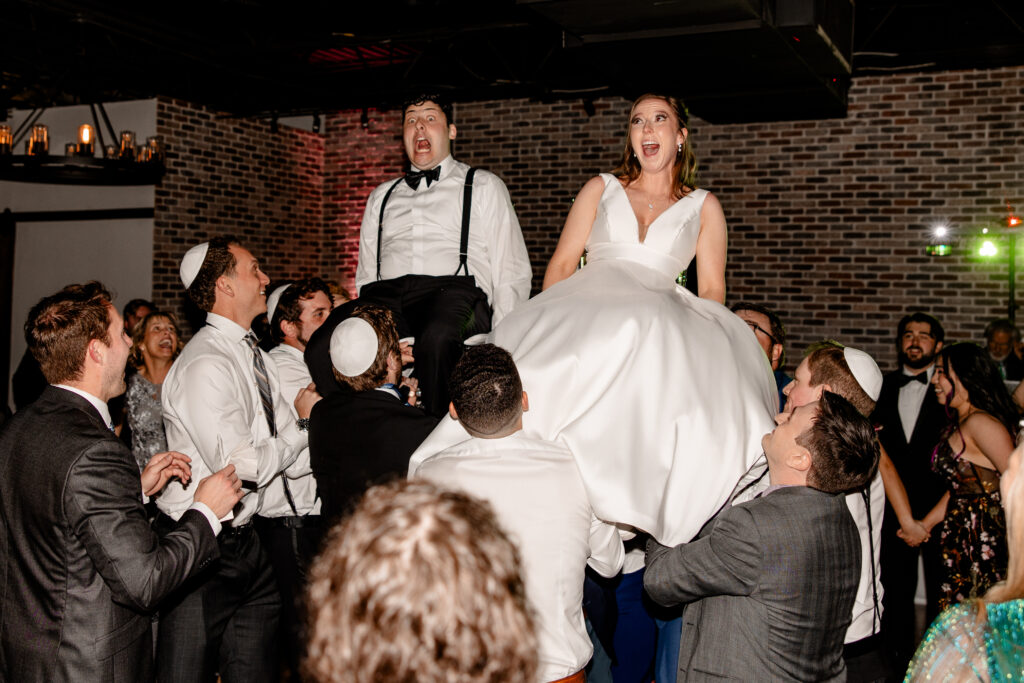 Jewish wedding Hora chair dance at Venue Forty50 Wedding In Dallas, Texas by Carlotti Photography Dallas Fort Worth Texas and Destination Wedding Photographer